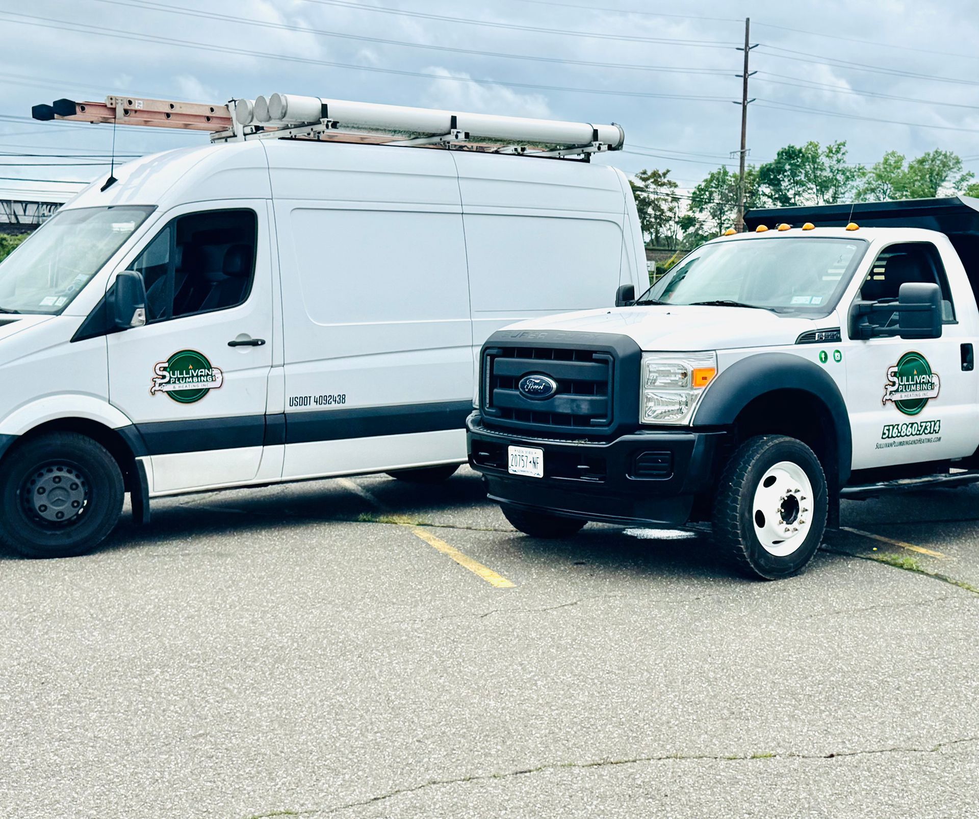 A van and a truck are parked next to each other in a parking lot.