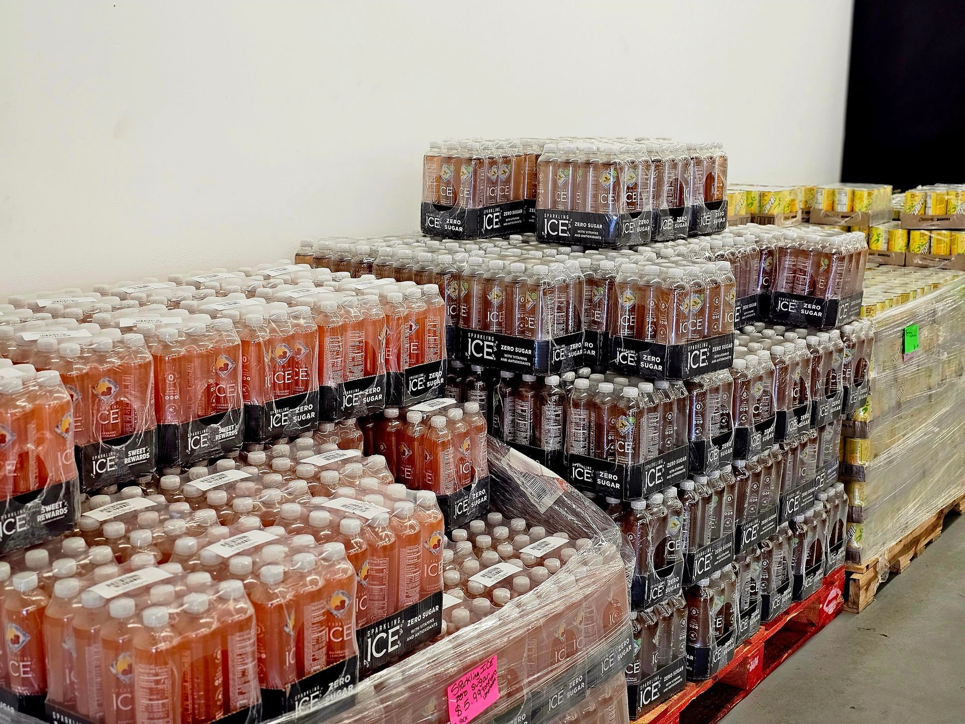 A warehouse filled with lots of bottles of soda.