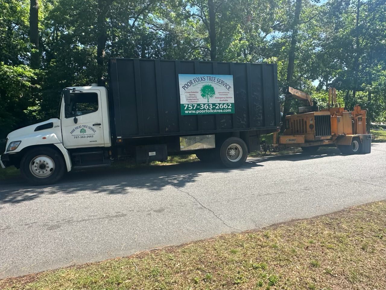 Poor Folks Tree Service's white truck
