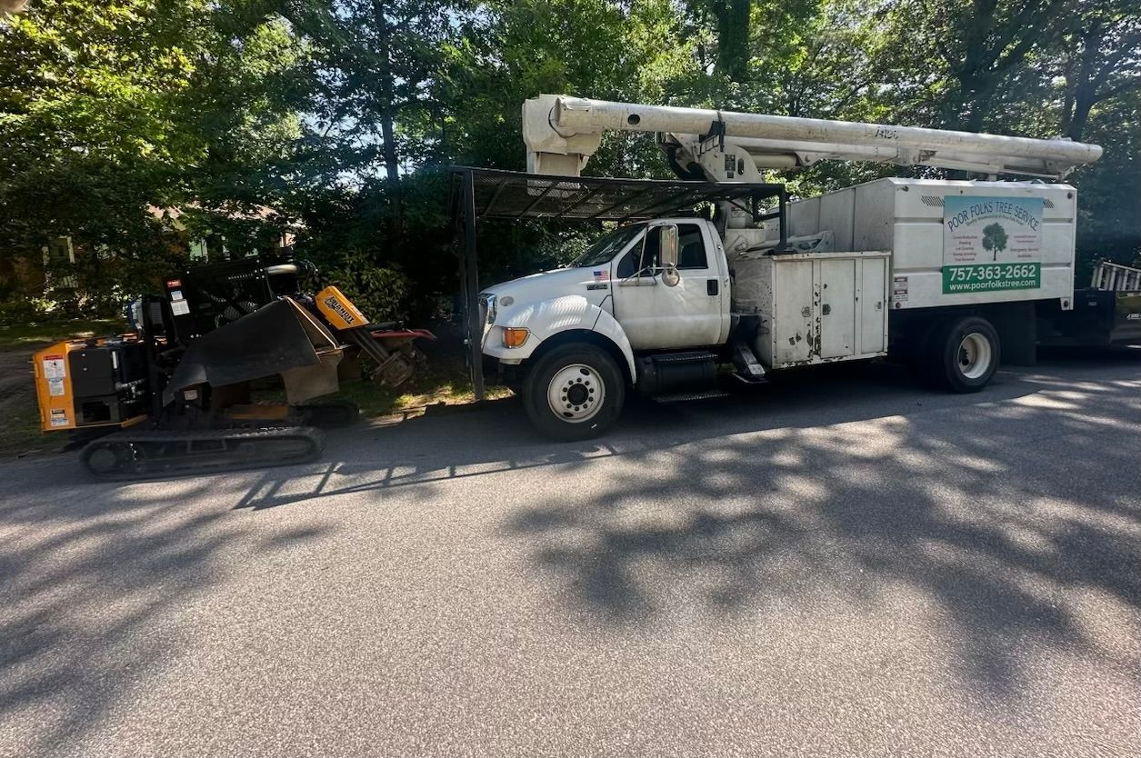White truck of Poor Folks Tree Service