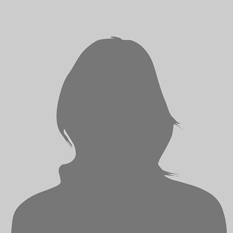 Silhouette of a person with short hair against a gray background.