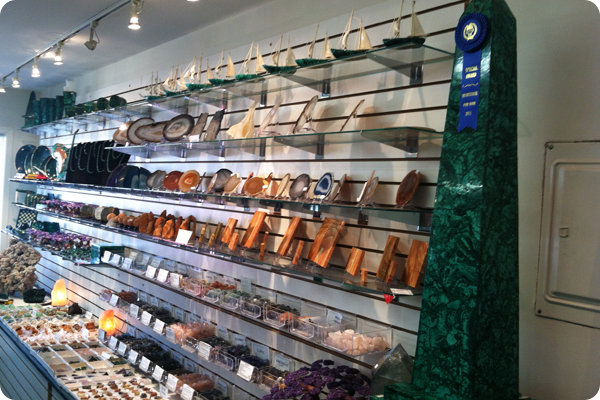 A store filled with lots of shelves and a blue ribbon