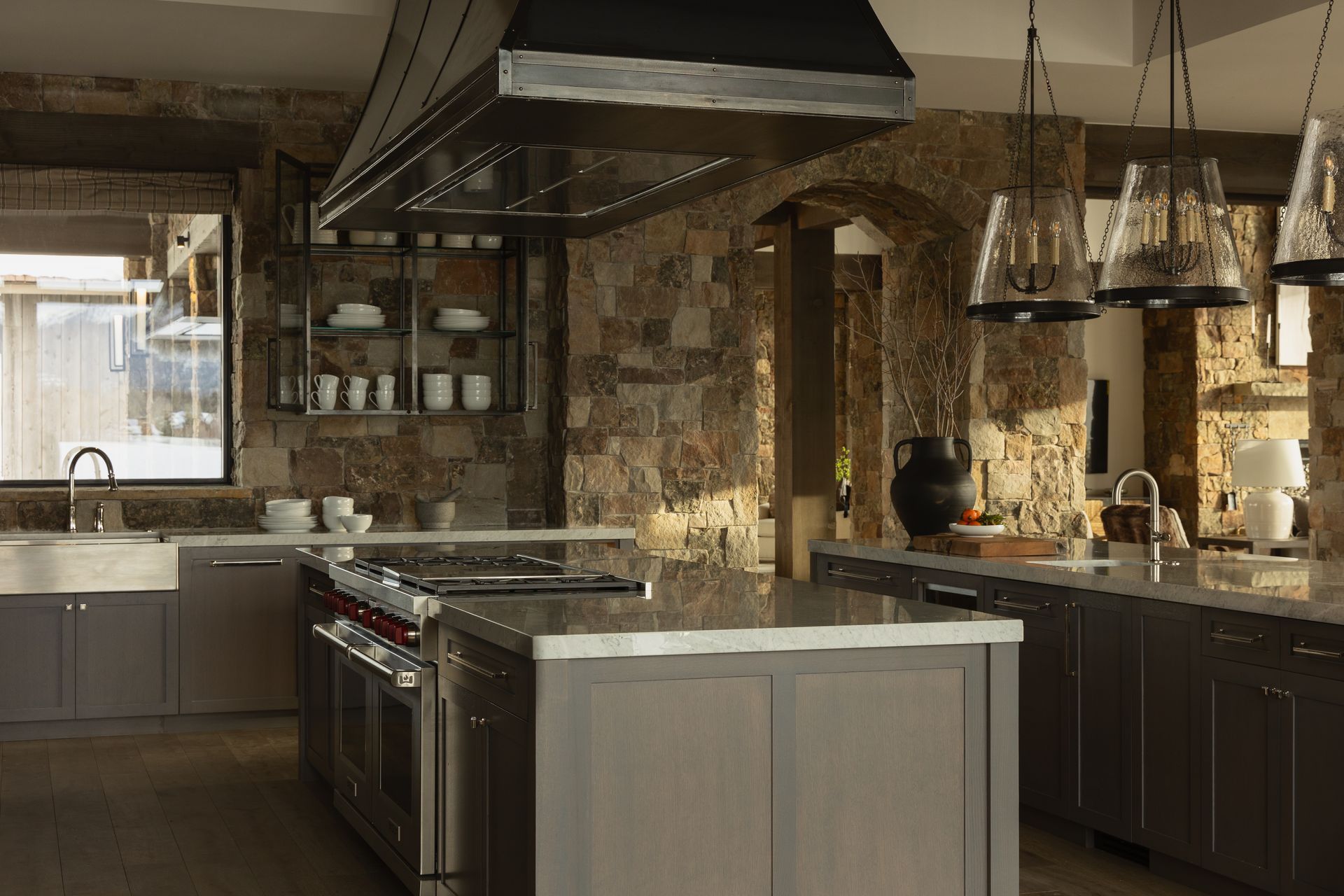 A kitchen with a large island and stainless steel appliances