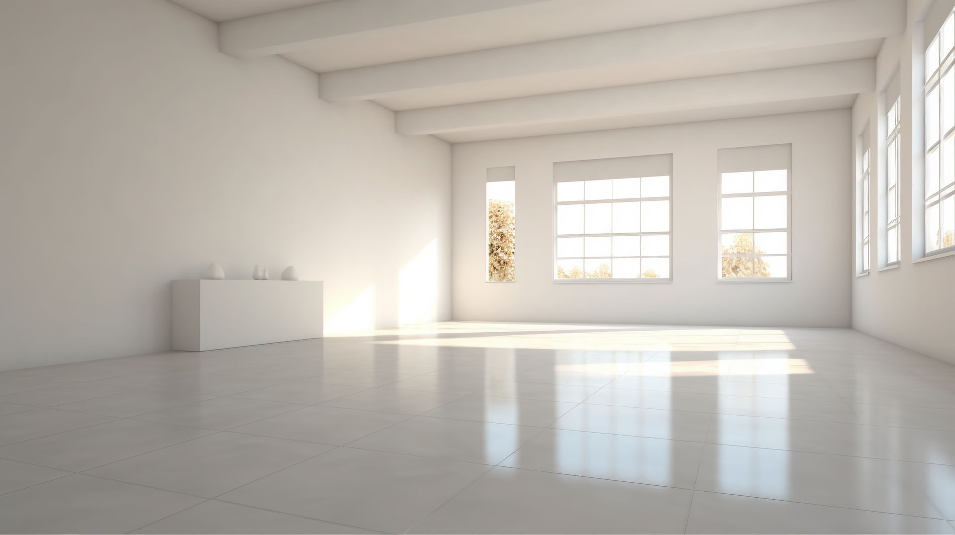 Bright empty white room with large windows and sunlight reflecting on the glossy floor