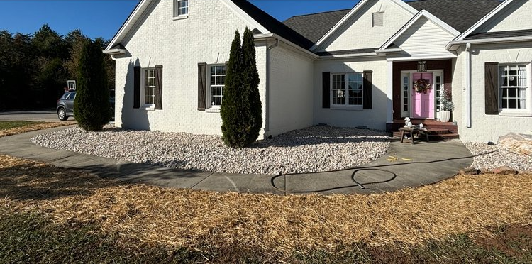 A white house with a patio in front of it