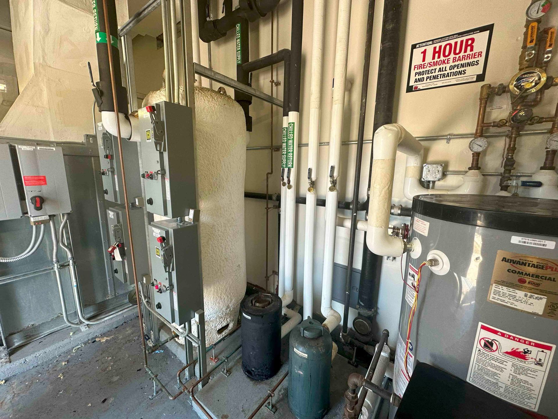 A room with a lot of pipes and a sign that says 1 hour.