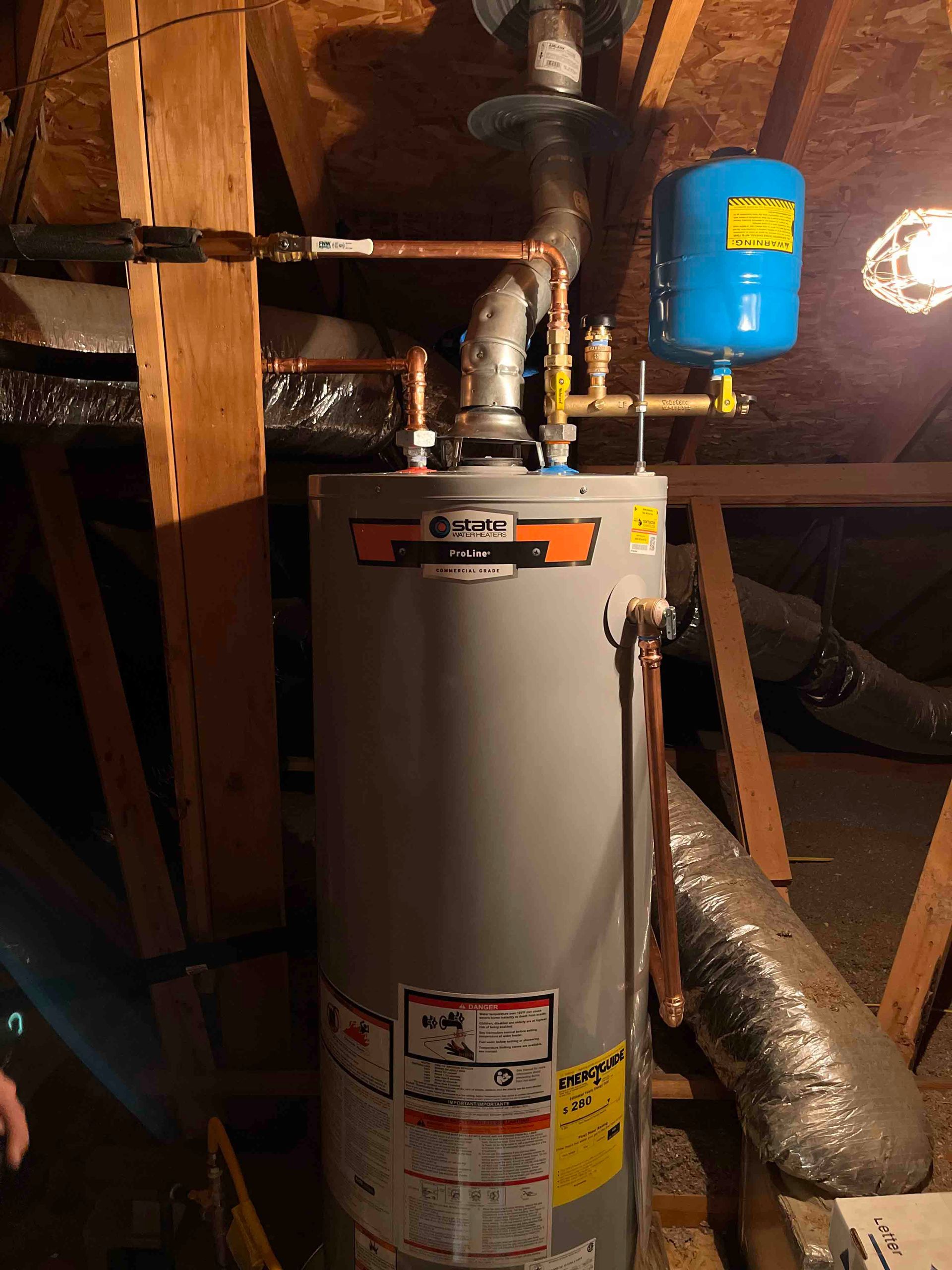 A water heater is sitting in the attic of a house.