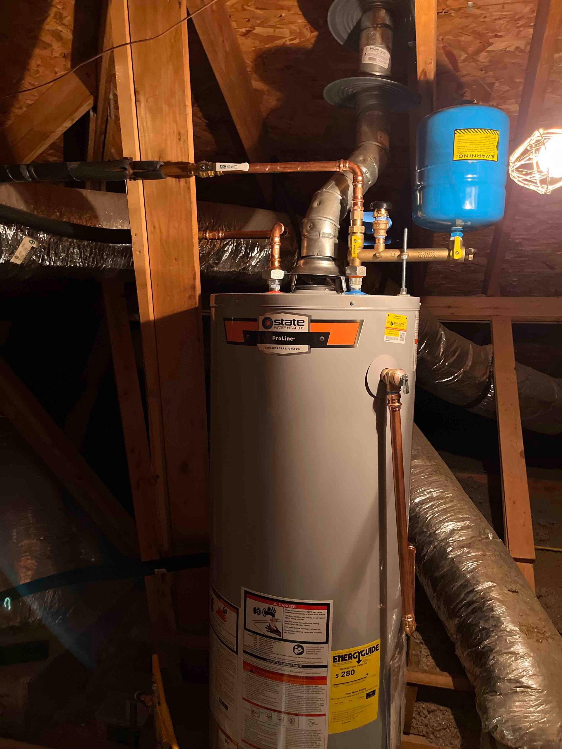 A water heater is sitting in the attic of a house.