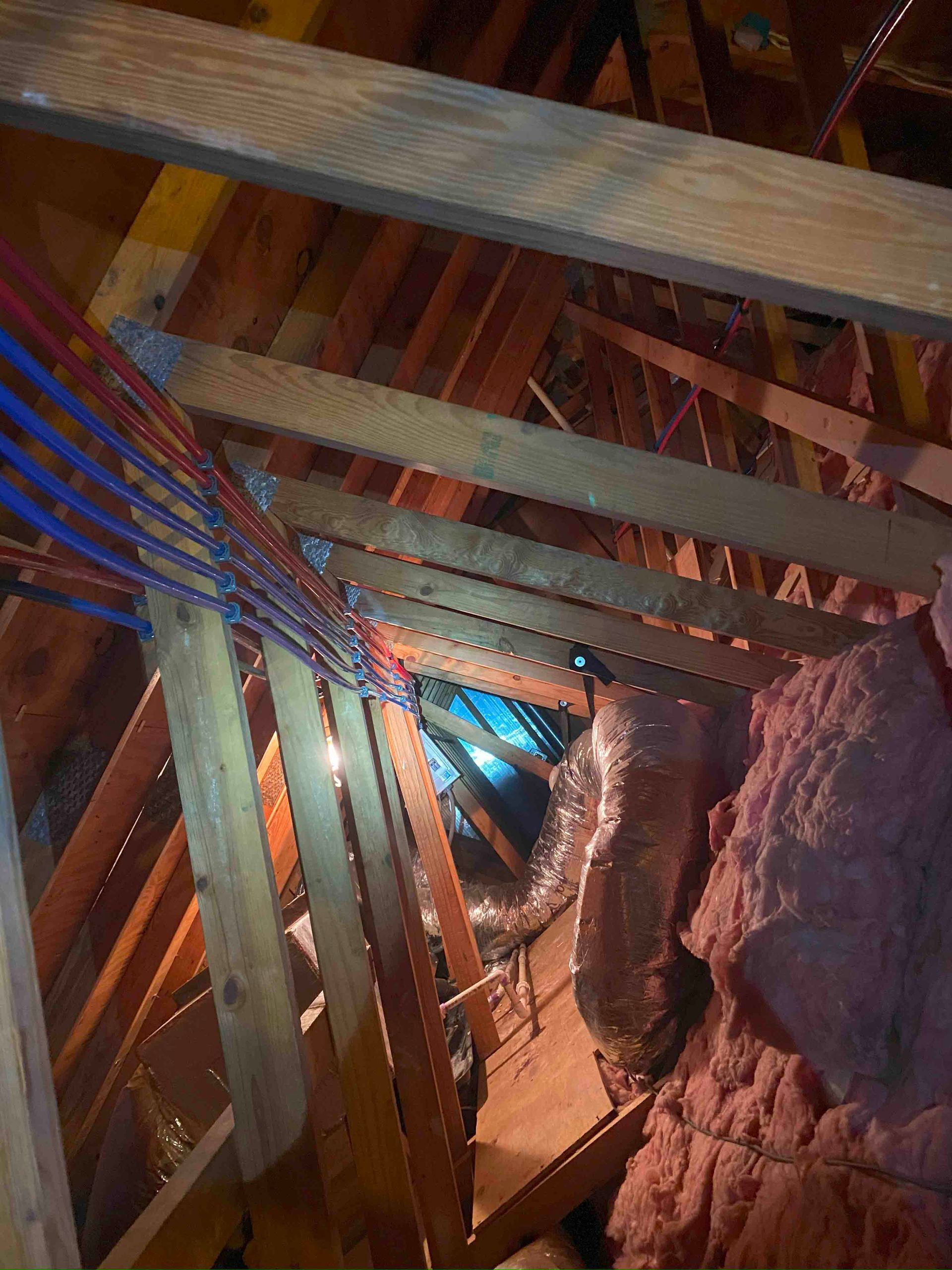 A wooden structure with a lot of wires coming out of it.