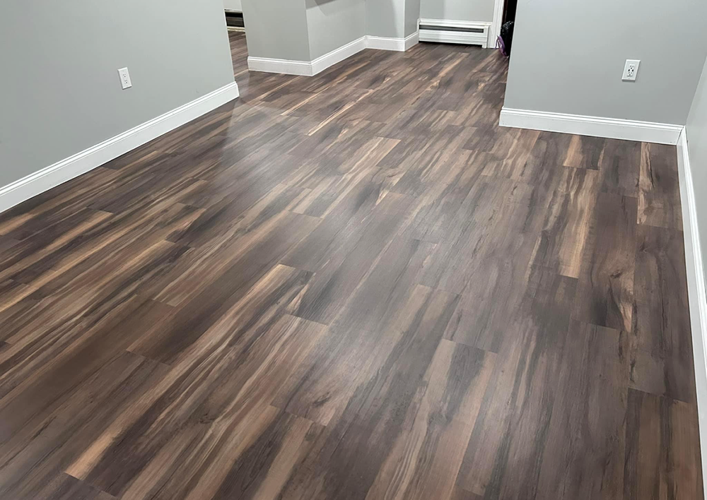 A wooden floor and white trim