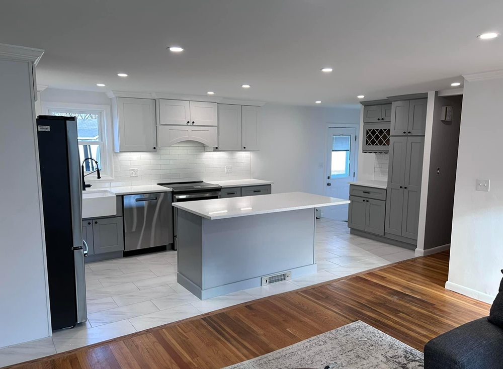 A kitchen with a large island in the middle of the room