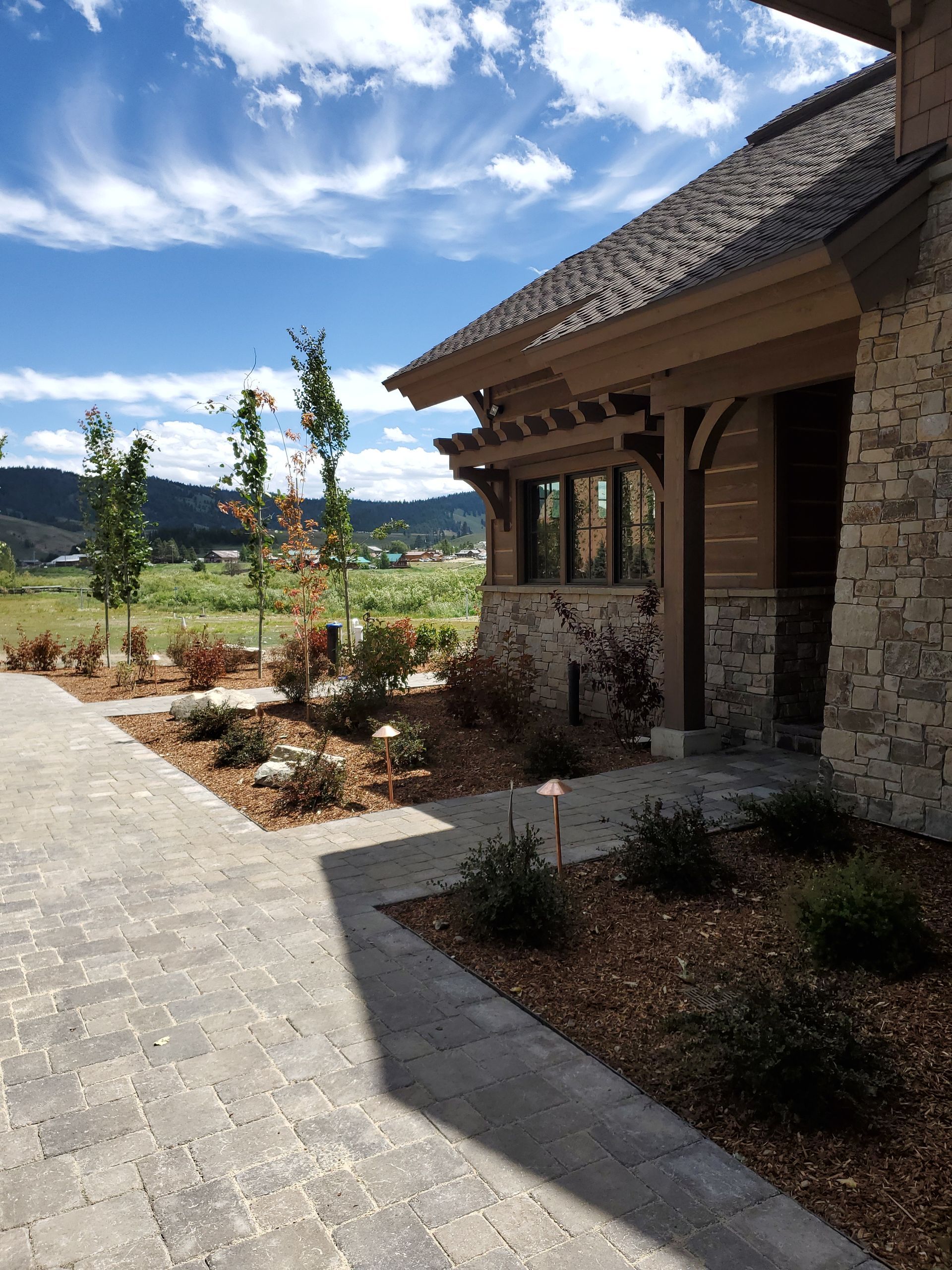 A stone house with a walkway leading to it