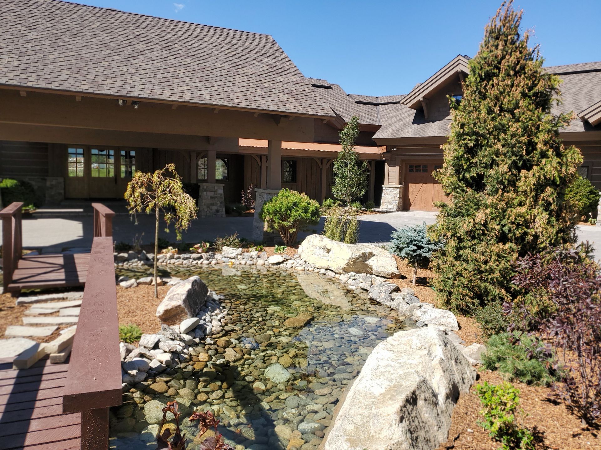 A house with a pond in front of it