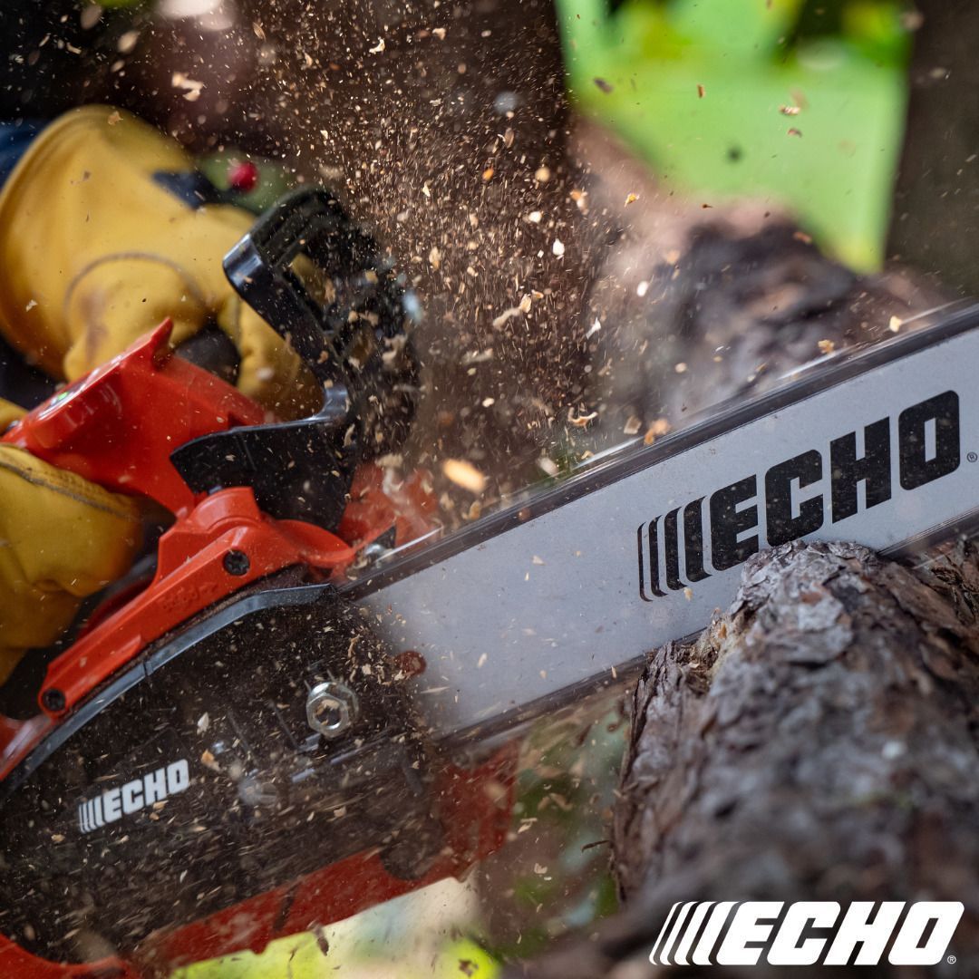 Chainsaw cutting wood, sparks flying. Red and black chainsaw, yellow-gloved hands, outdoor setting.