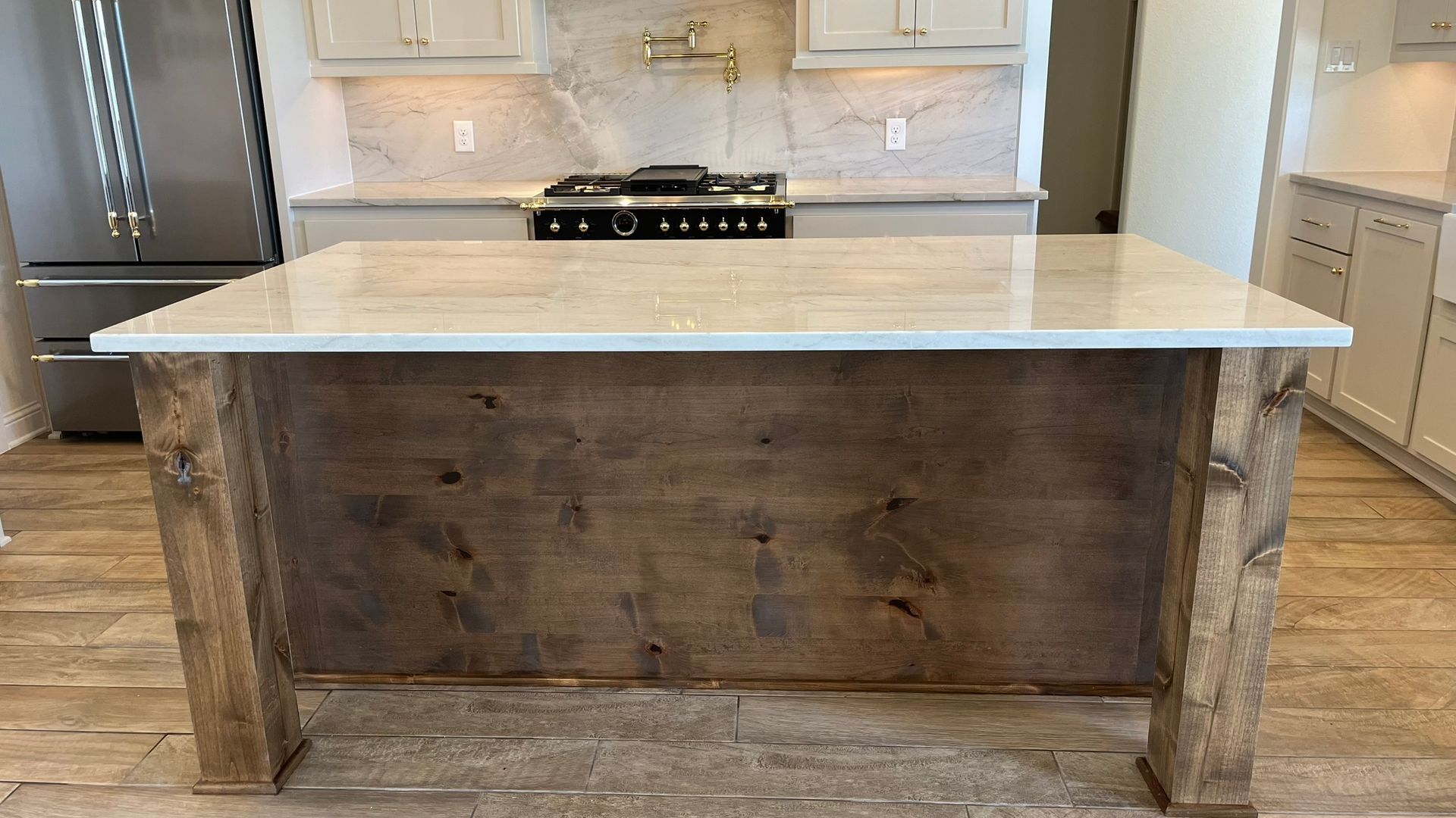 A kitchen with a large island in the middle of it