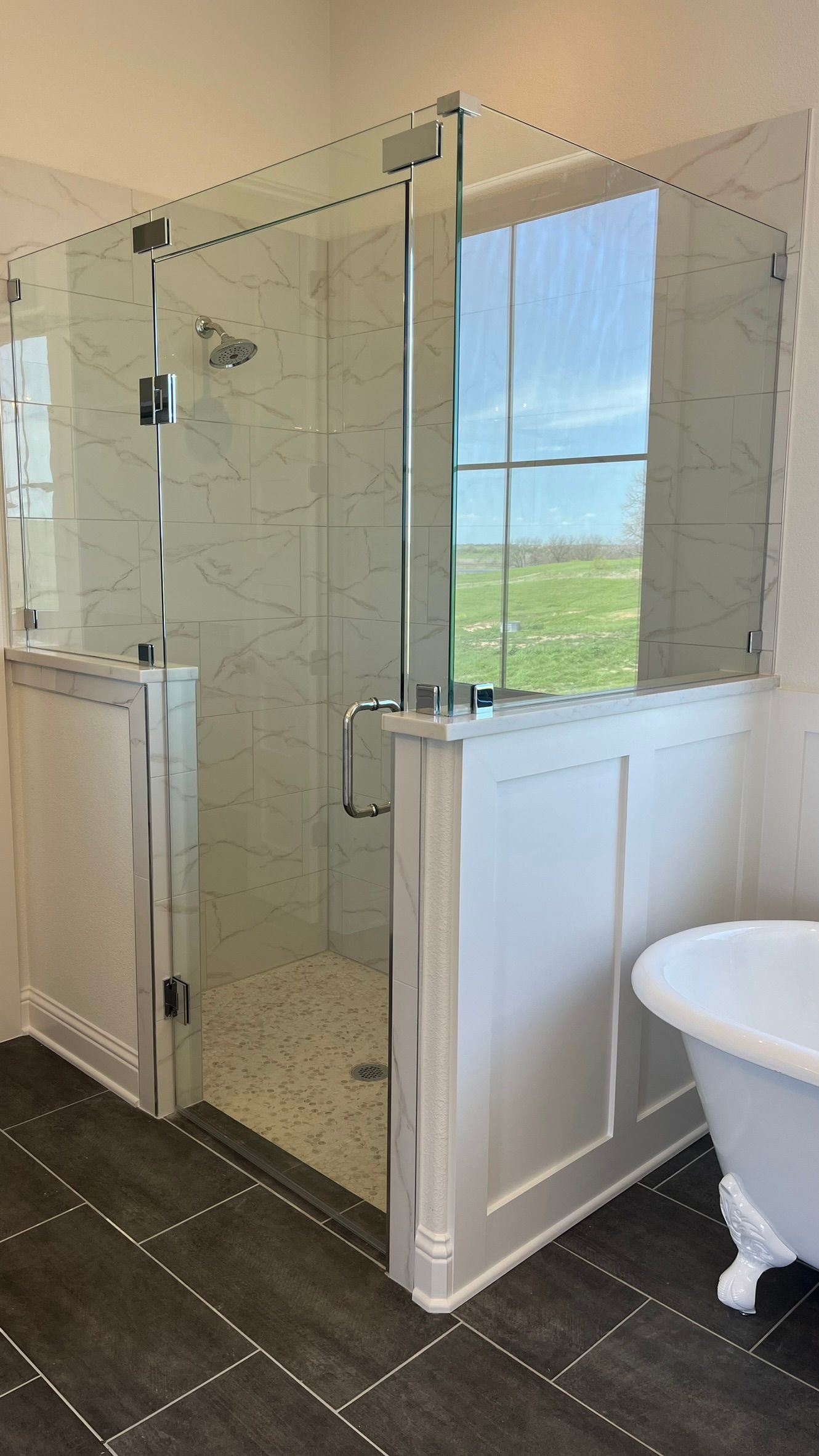 A bathroom with a tub and a walk in shower