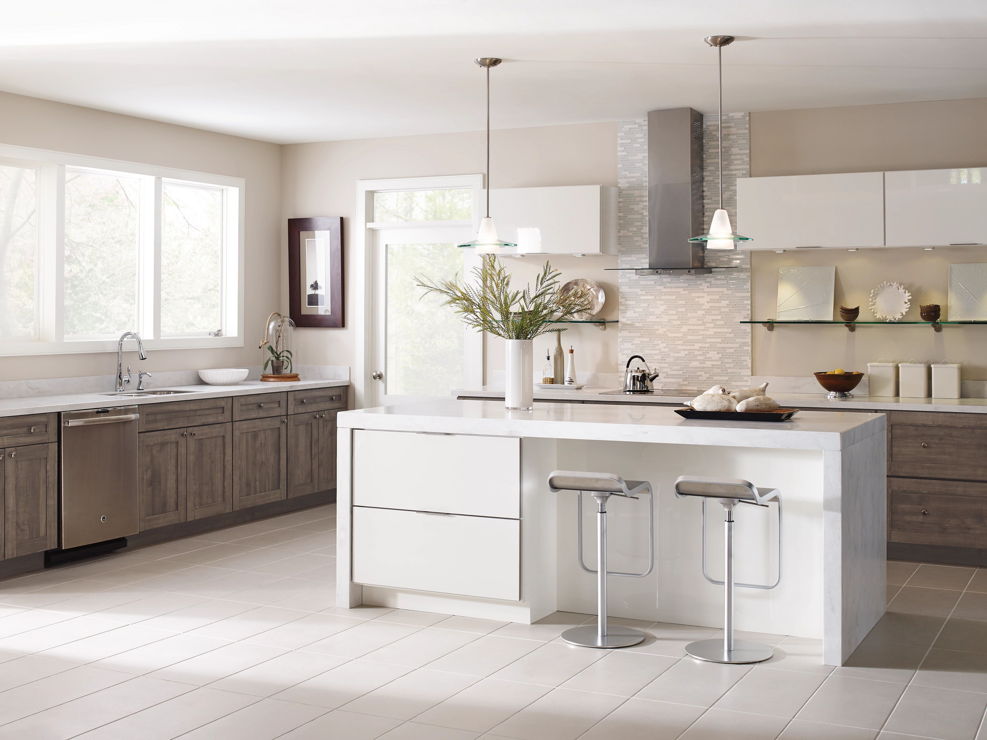 a kitchen with a large island and two stools