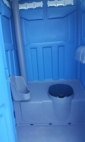 Interior of a blue portable toilet. Features a toilet, urinal, and ventilation tube.