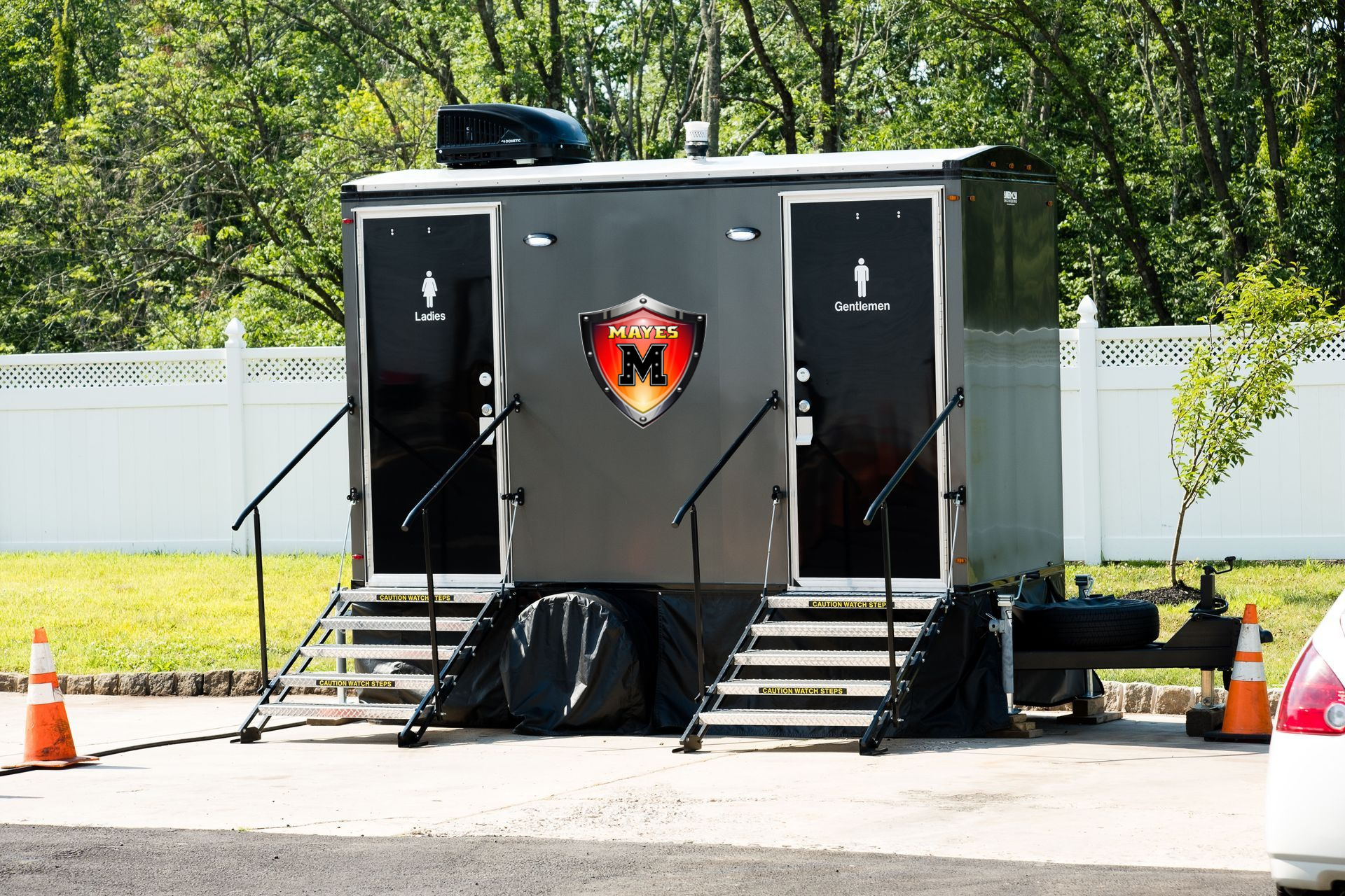 Bright yellow, cylindrical containers stacked in rows. Two white containers at the bottom.