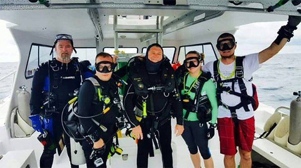 People wearing scuba equipment