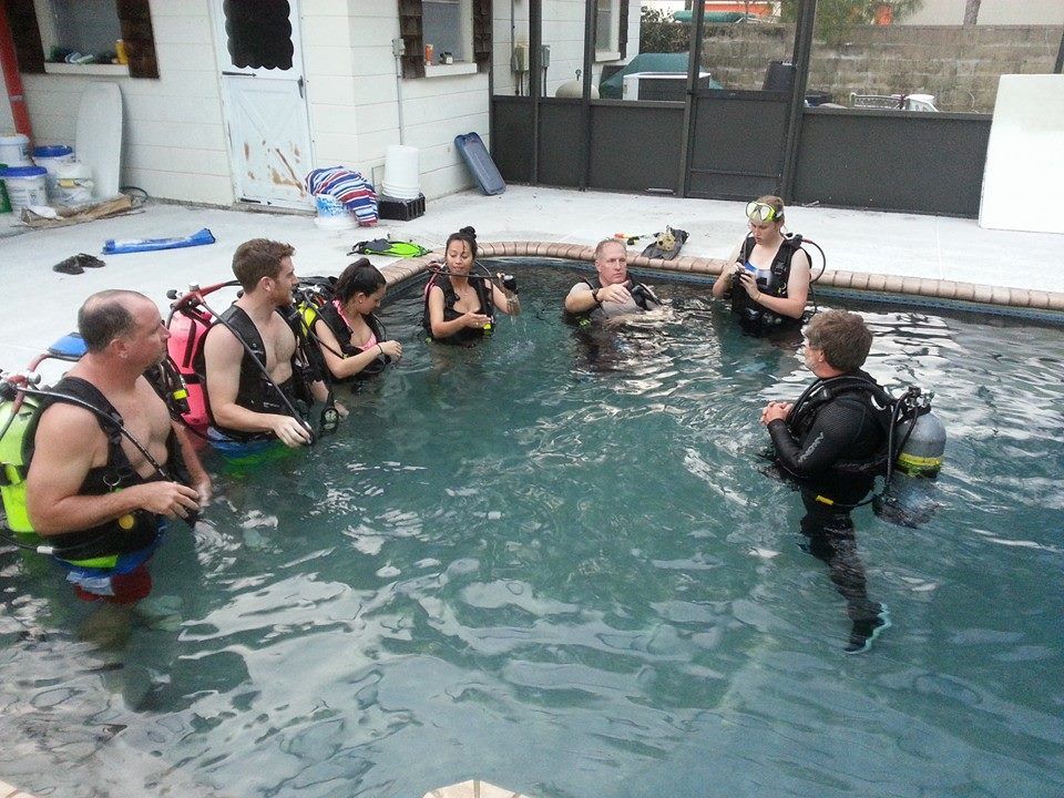 Wearing scuba equipment