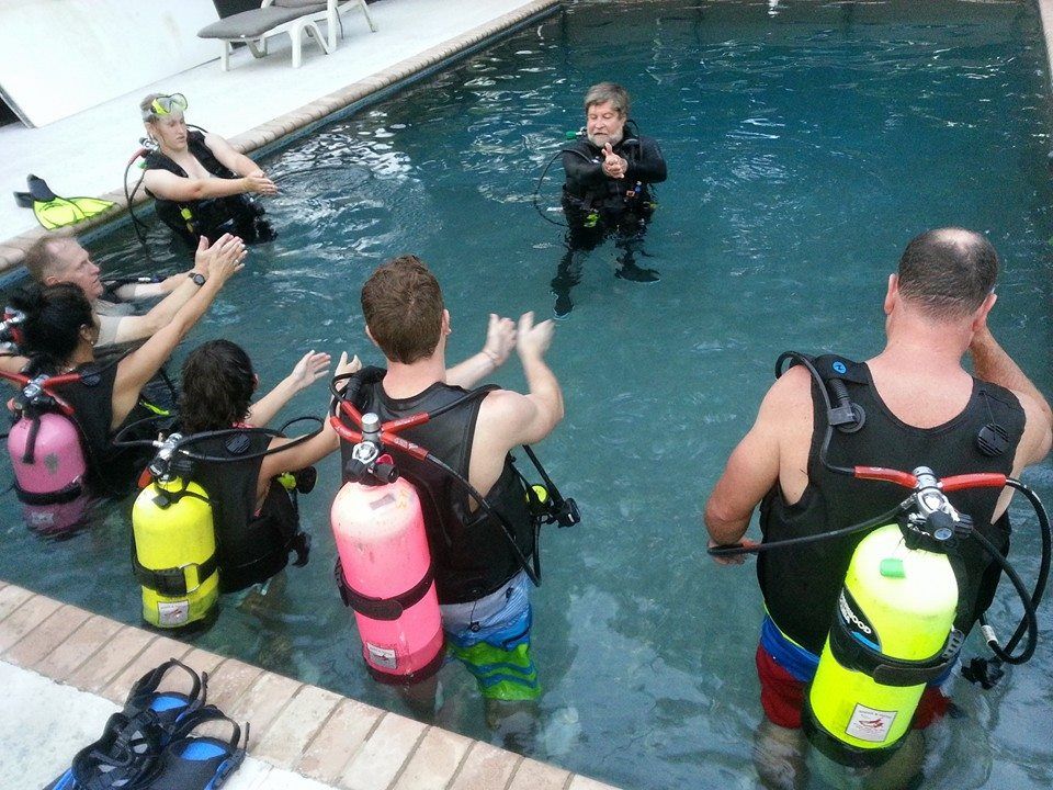 People listening to scuba trainer