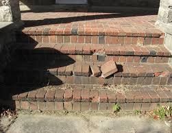 Brick steps with broken bricks, cast shadow.