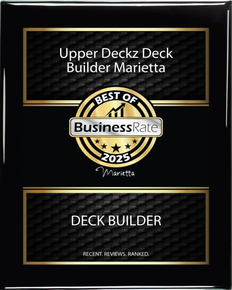 A black and gold plaque that says upper deckz deck builder marietta