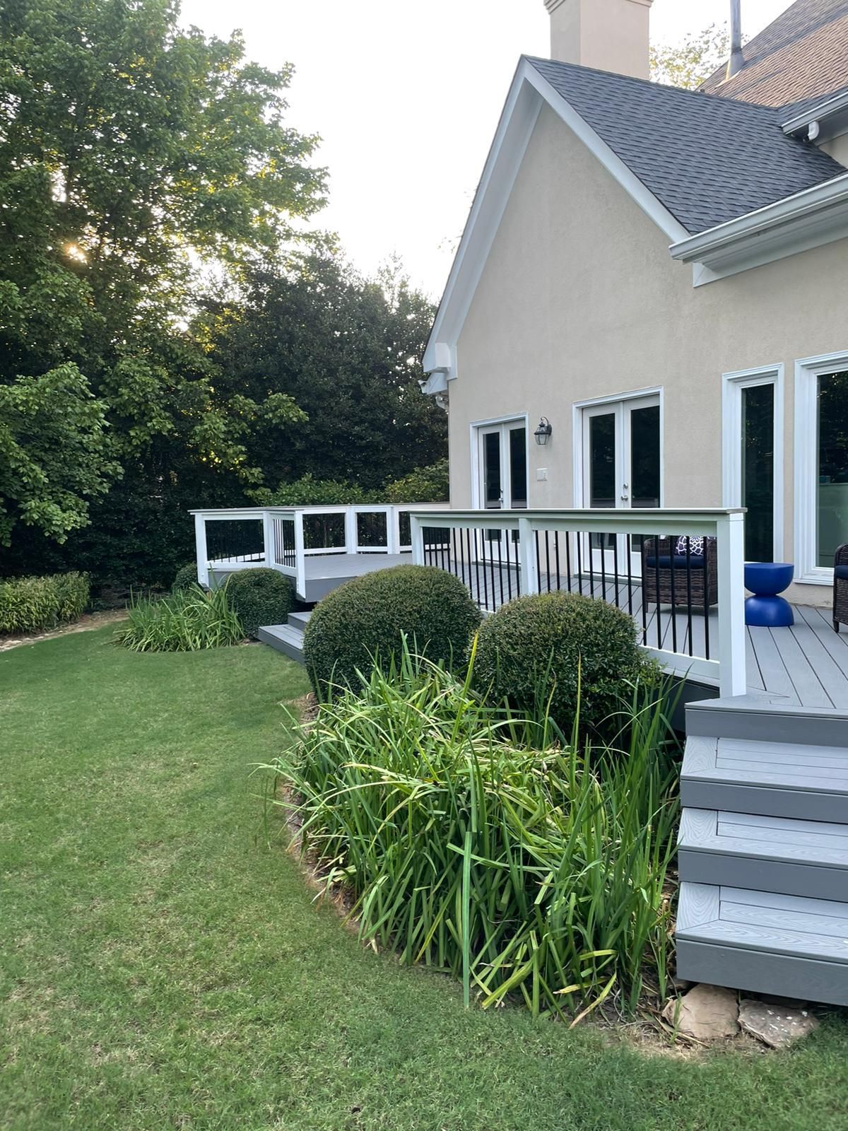 A large house with a large deck in the backyard