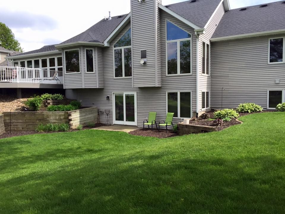 A large house with a large lawn in front of it
