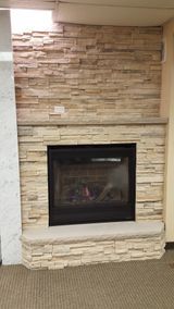 There is a fireplace in the middle of the room.