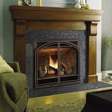 A living room with a fireplace and a couch.