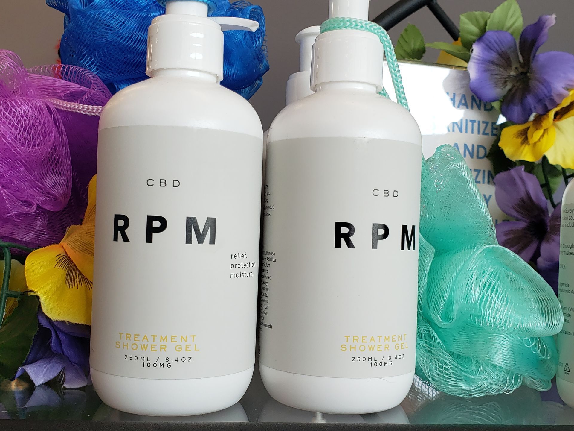 Two bottles of rpm are sitting next to each other on a shelf