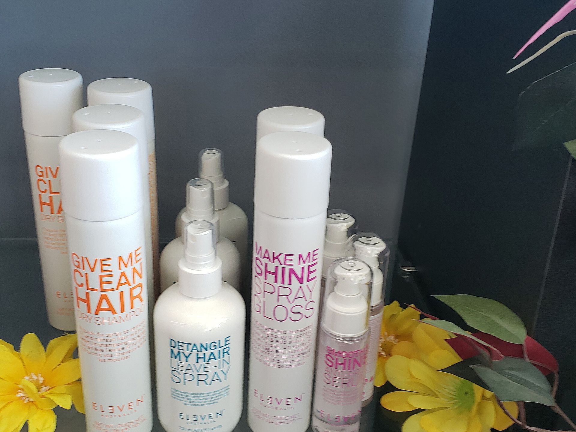 A bunch of hair products are sitting on a table