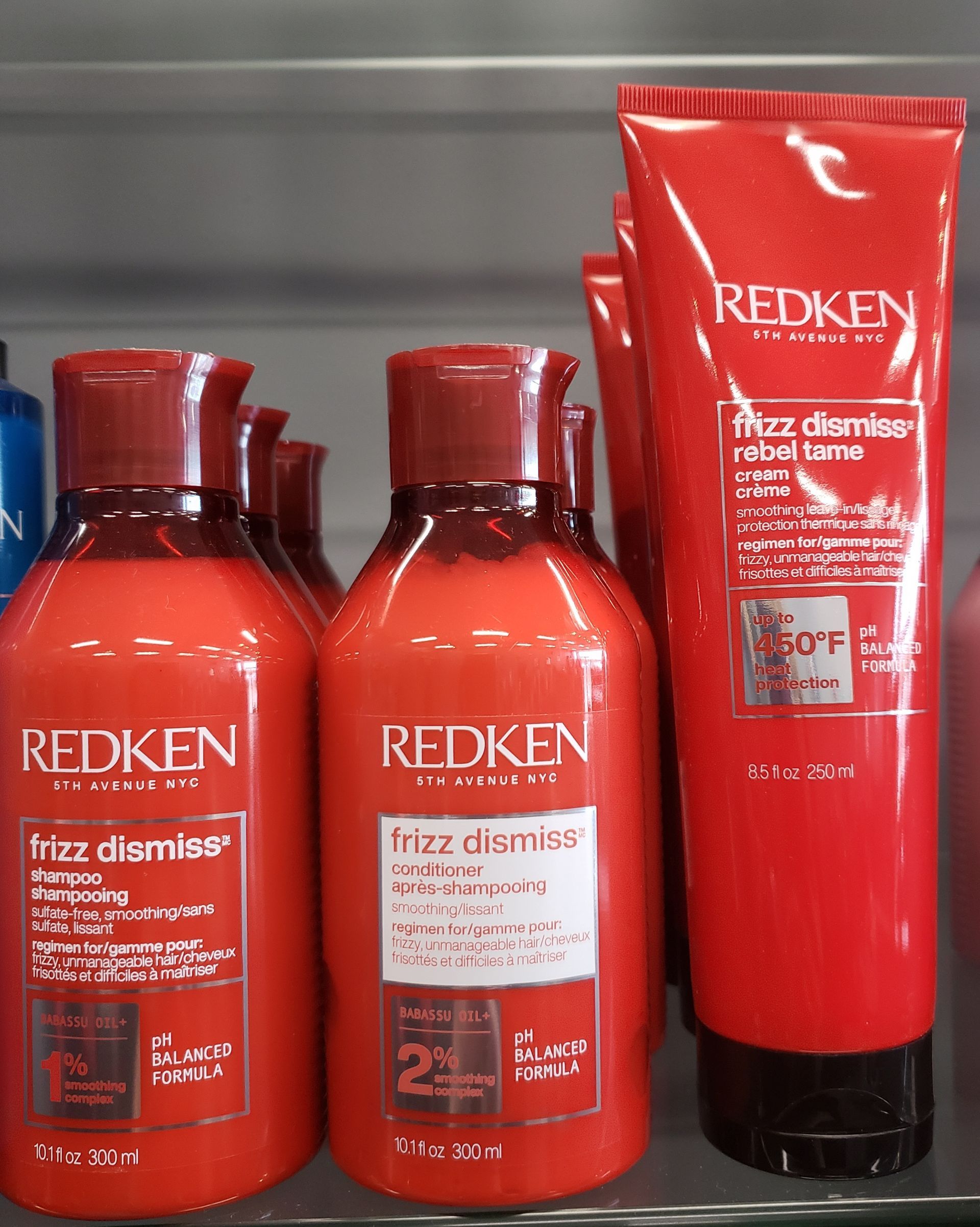 Bottles of redken hair products on a shelf
