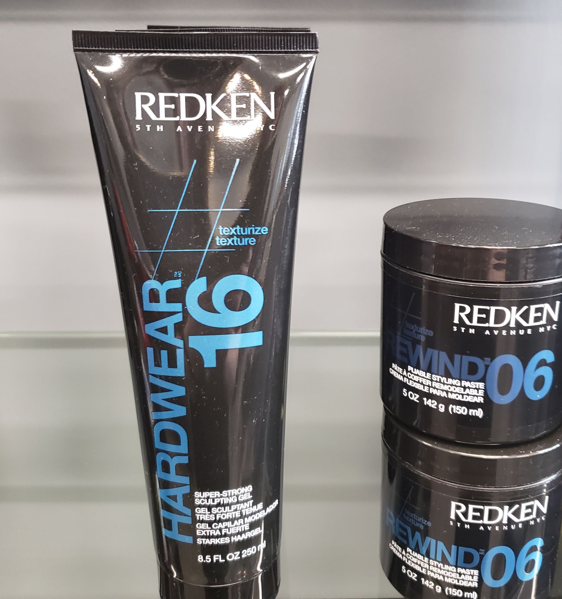 A tube of redken hardwear 16 and a jar of redken wind 06