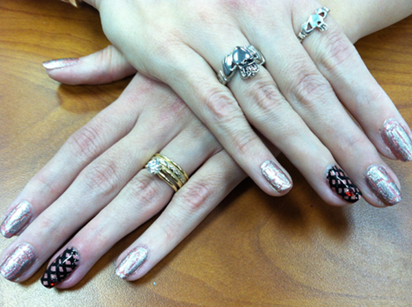 A close up of a woman 's hands with rings on them
