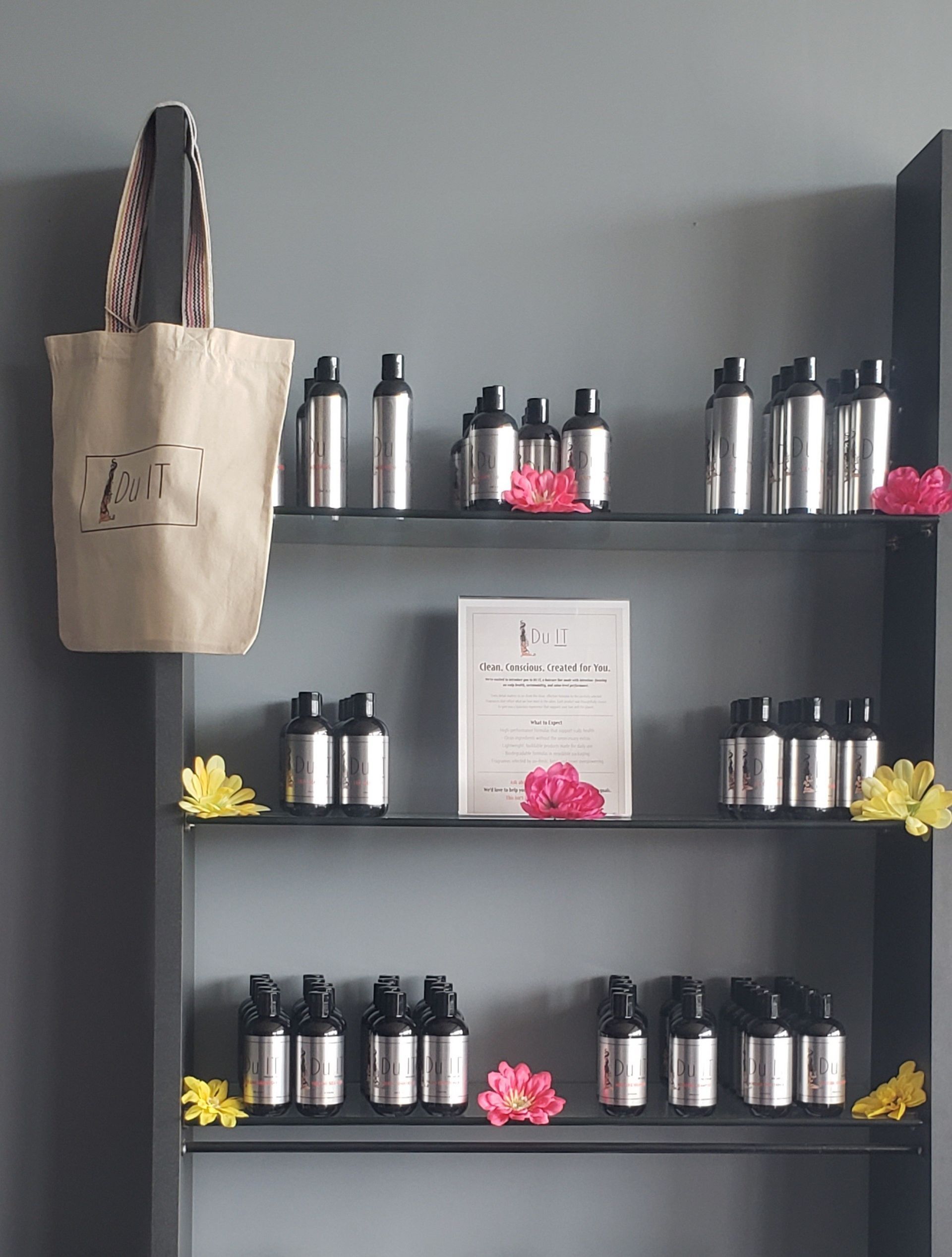 A shelf full of bottles and a bag.