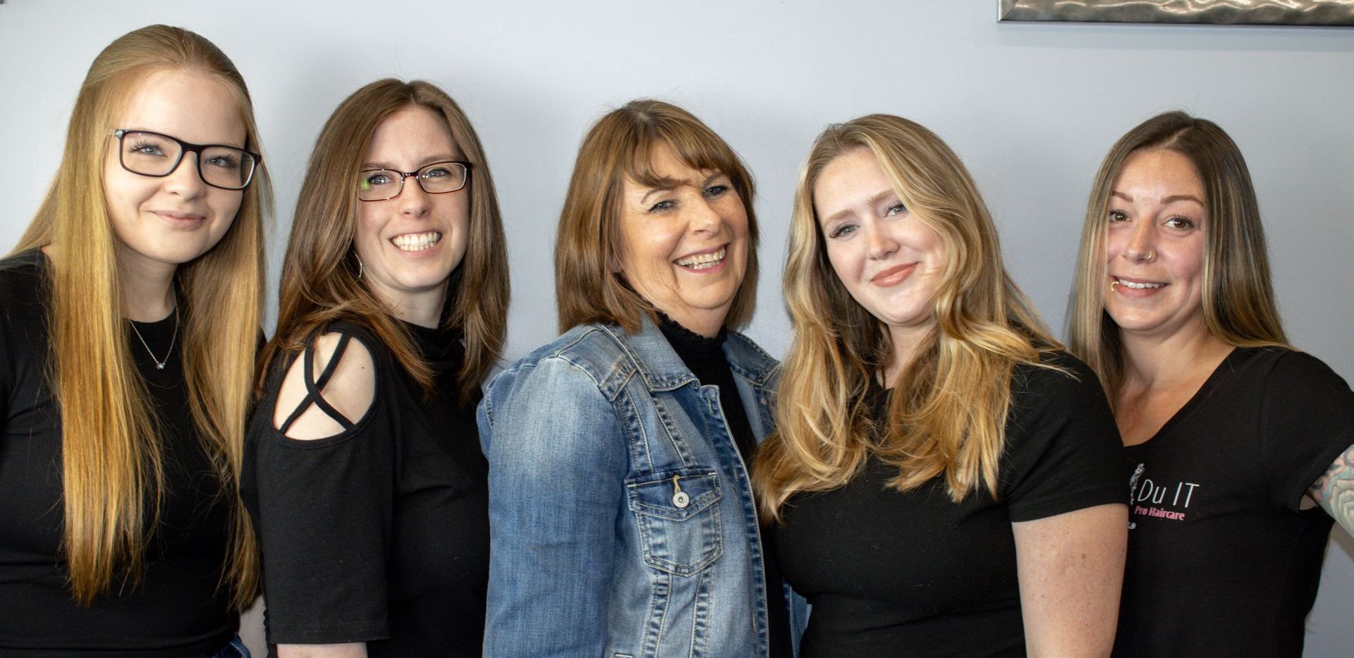 A group of women are posing for a picture together.