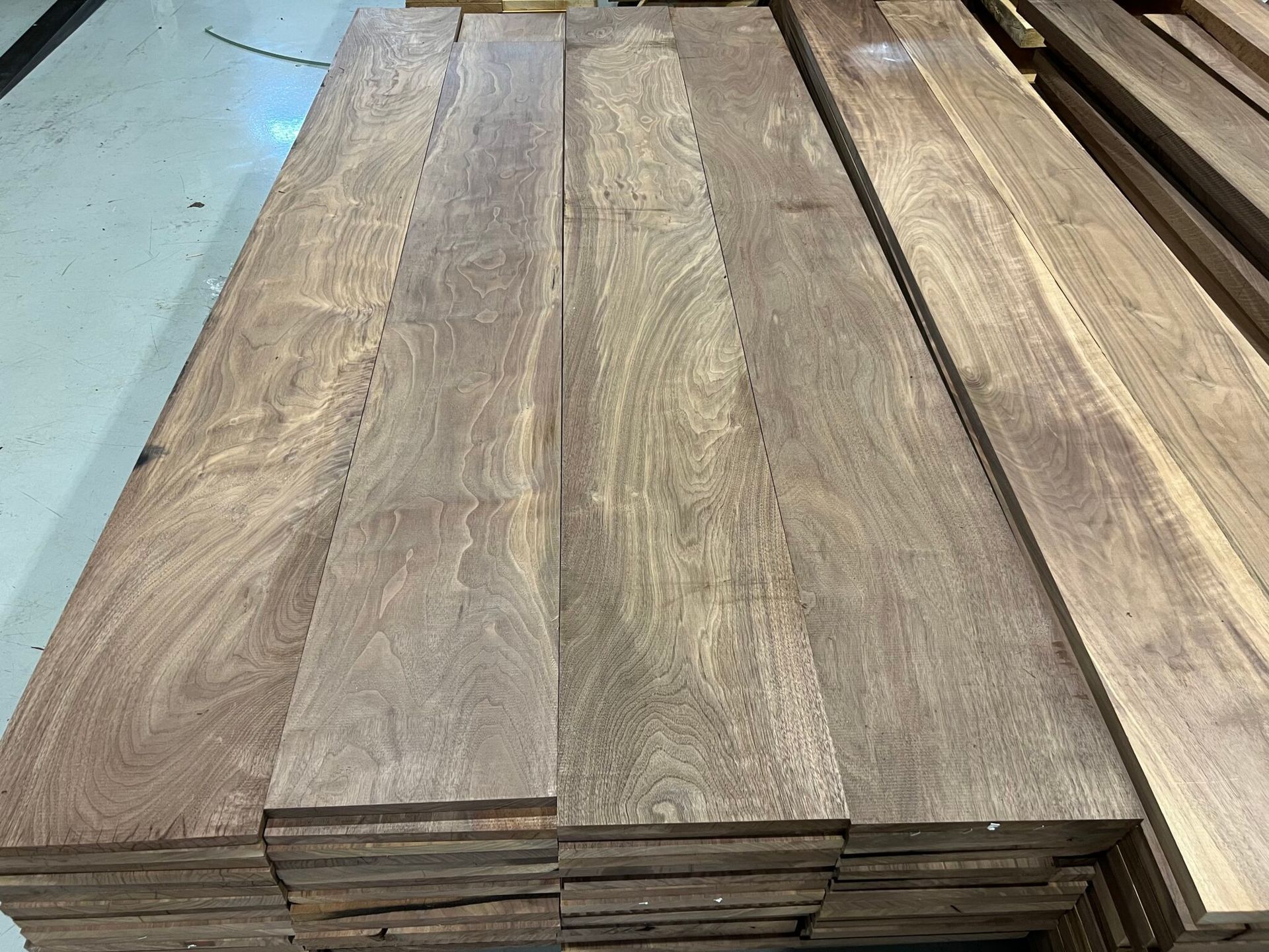 A stack of wooden boards sitting on top of each other on a table.