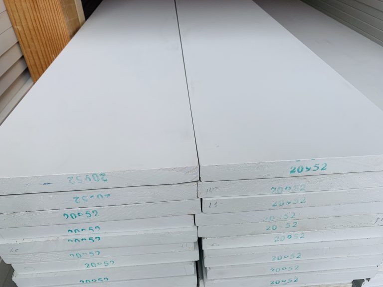 A stack of white boards with numbers on them