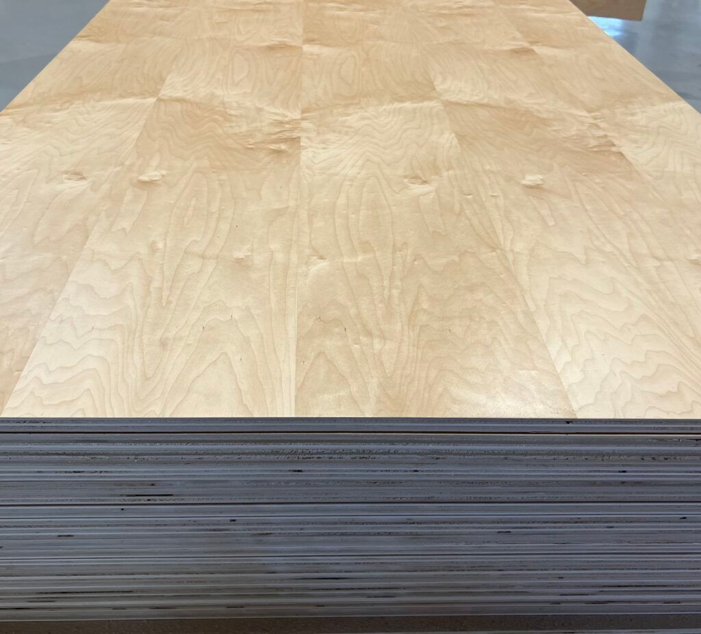 A stack of plywood is sitting on top of each other on a table.