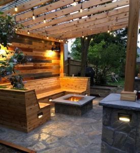 There is a fire pit in the middle of the patio.