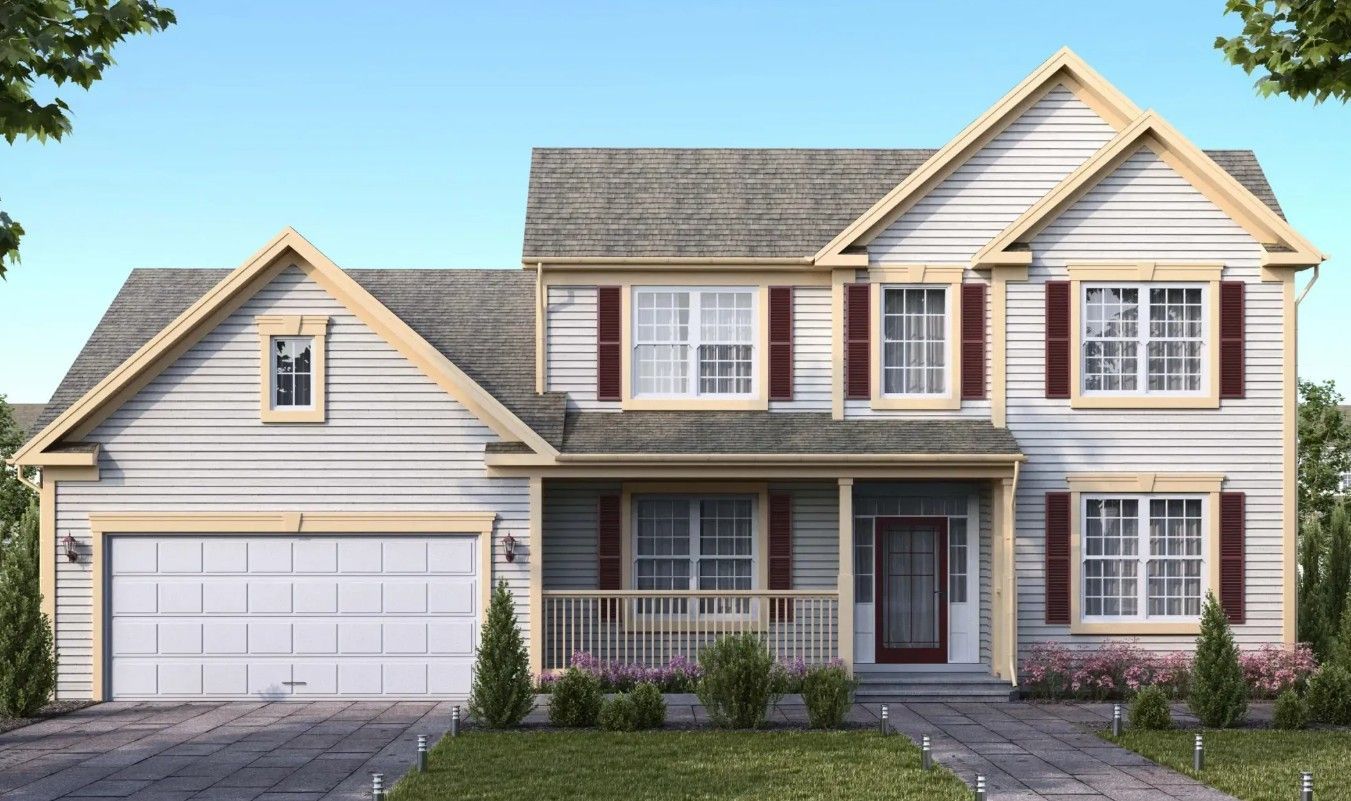 Two-story beige suburban house with gray roof, white trim, and a two-car garage under a blue sky