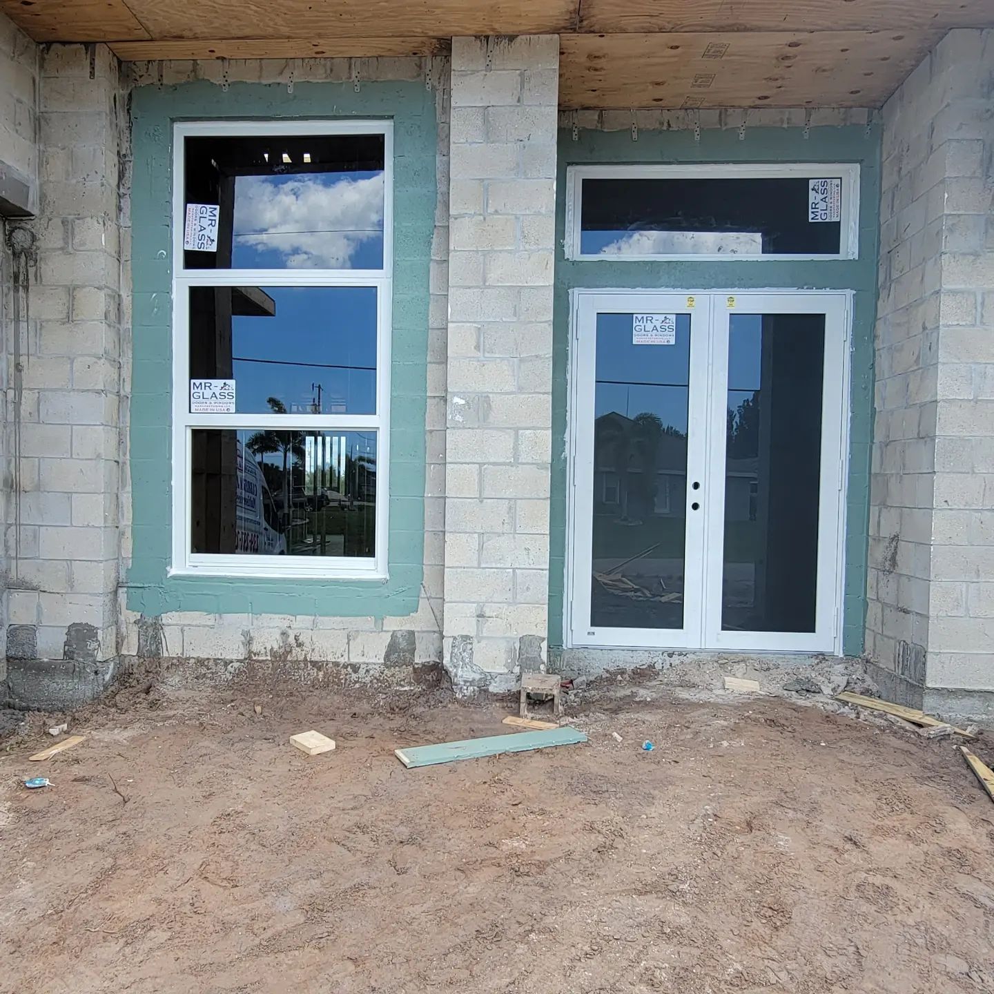 A brick building with a lot of windows and doors