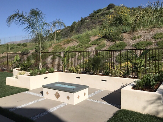 There is a fire pit in the middle of the patio.