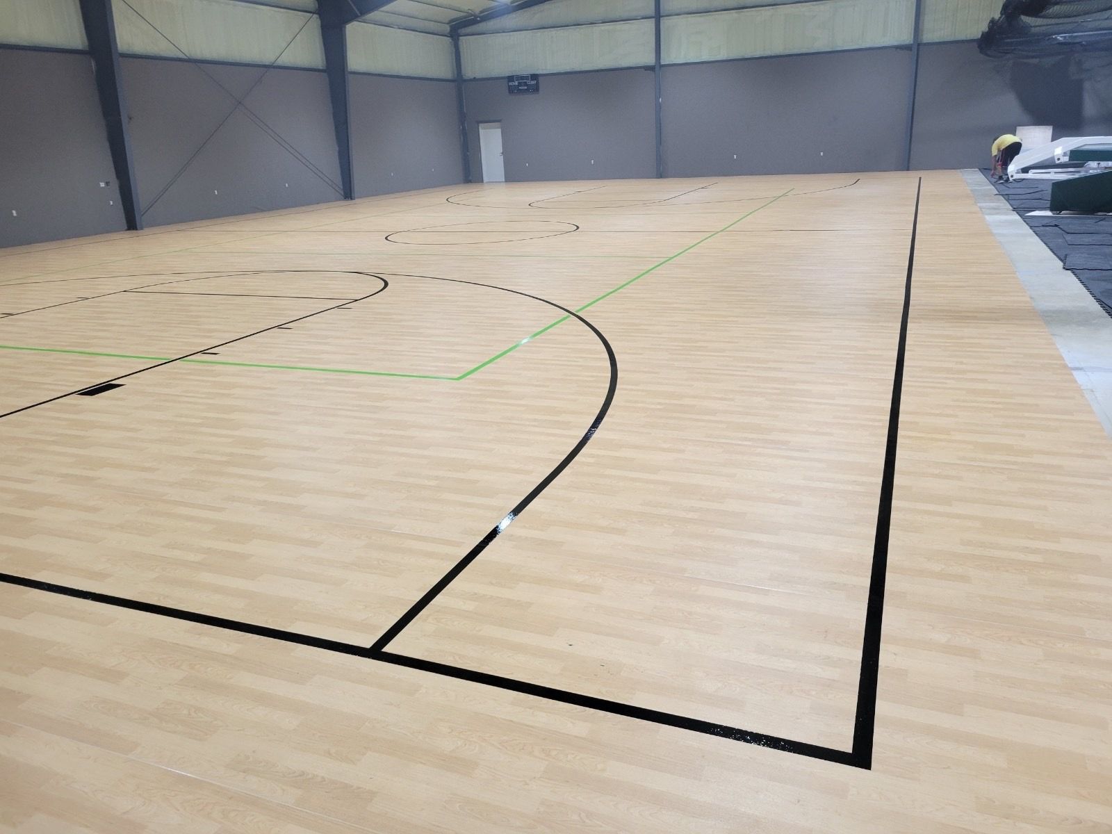 A basketball court is being built in a building