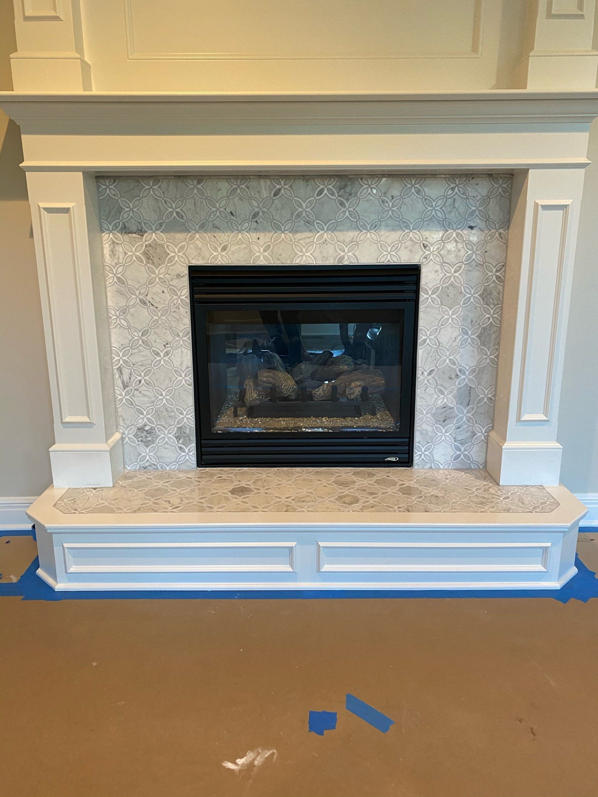 There is a fireplace in the middle of the room.