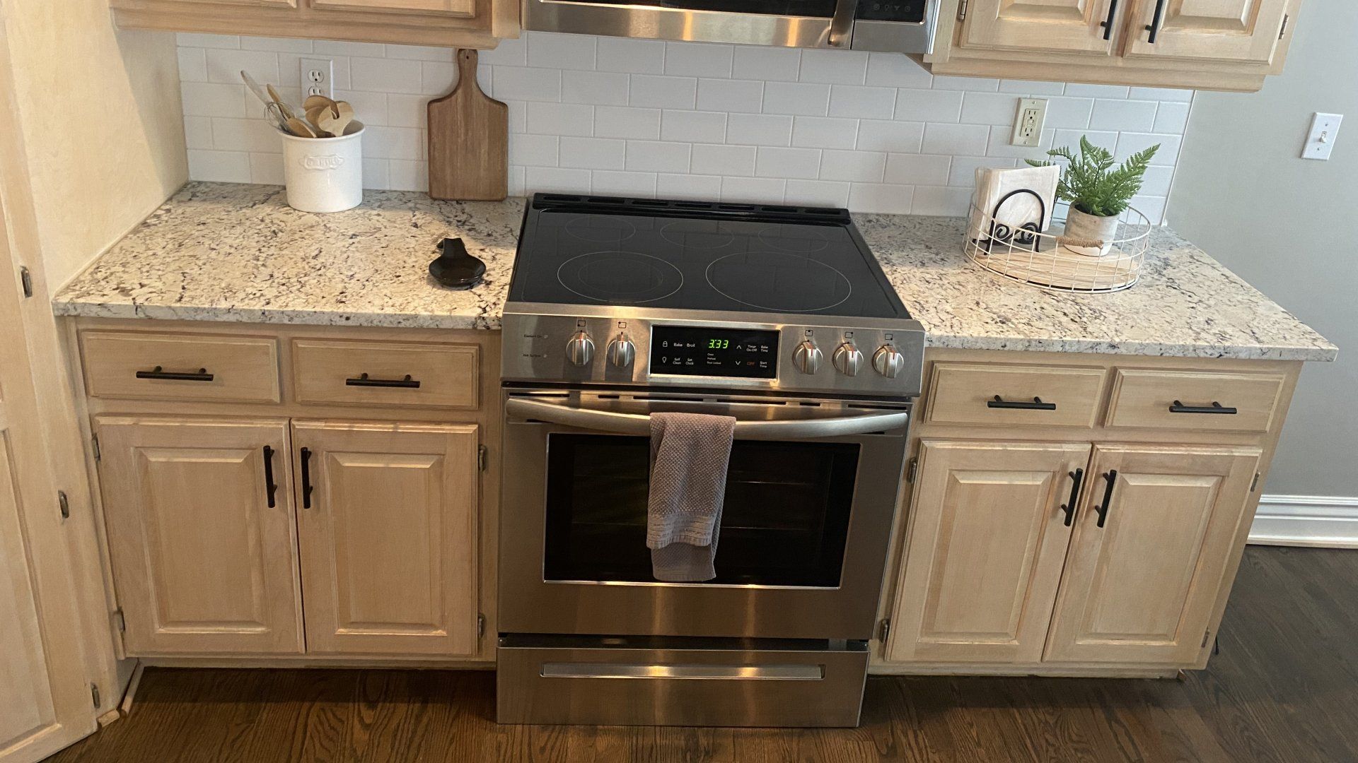 A kitchen with stainless steel appliances and granite counter tops.