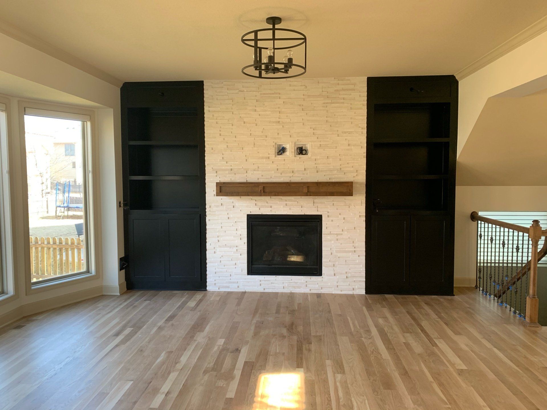 There is a fireplace in the middle of the living room.